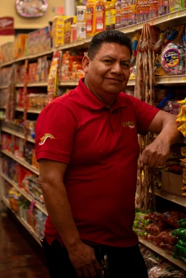 Angel Juarez stands inside of El Potrero Market. 
