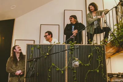 The Lingo standing on a staircaise.