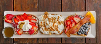 French Toast Flight: Stuffed F.T. (Nutella and sliced strawberries), Cinnamon Crunch Toast, and Classic French Toast. Photo: Talyn Bezhad.