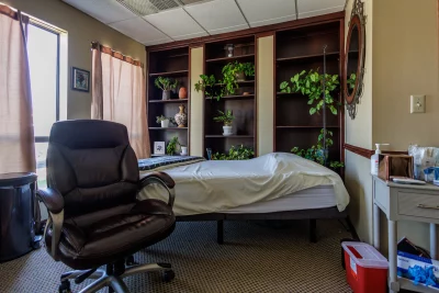 A clinic room at Restorative Health Utah filled with plants.