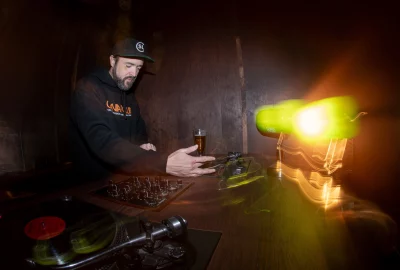 Ramirez sets a vinyl on to play. 