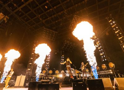 Cage the Elephant playing on stage with Matt Shultz jumping in the air as flames erupt from up and down the stage. Photo: @lmsorenson