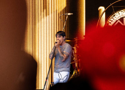 Anthony Kiedis of the Red Hot Chili Peppers is captured in between the crowd as he sings center stage. Photo: @lmsorenson