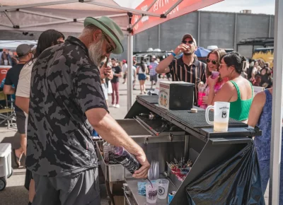 Five Wives Vodka prepares a cocktail of robust color for a Brewstillery attendee. Photo: Talyn Behzad.