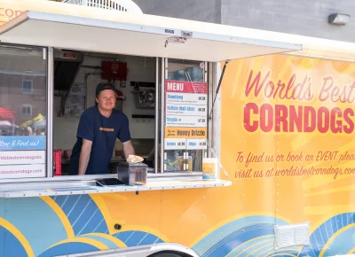 If you haven’t seen or tried one of the tasty corn dogs from World’s Best Corn Dog, you’re missing out. Chris serves them fresh out of the fryer. Photo: Chay Mosqueda.