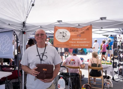 Glen Brown shows off Lyman and Brown's fine leatherwork. Photo: Brayden Salisbury.