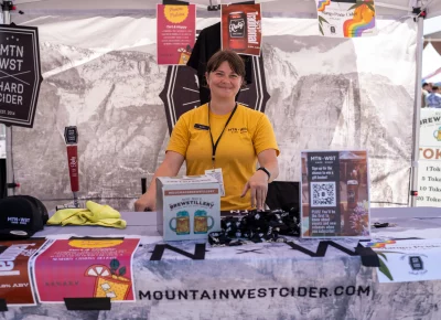Katie Petrozzo is stoked to serve Mountain West's delicious cider. Photo: Brayden Salisbury.