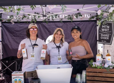 Jill Watanabe, Amber Berson and Erin Camargo serve Tsuki Sake to the people. Photo: Brayden Salisbury.