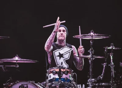 Travis Barker shows off his signature stick tricks.