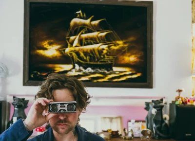 Man looking through binoculars.