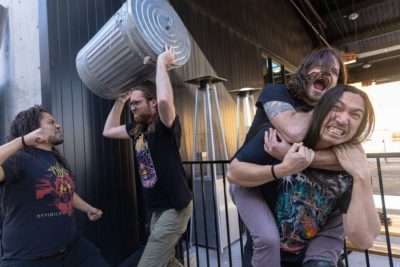 Debrider band goofs off together