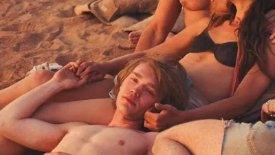 Man laying on a person's legs.