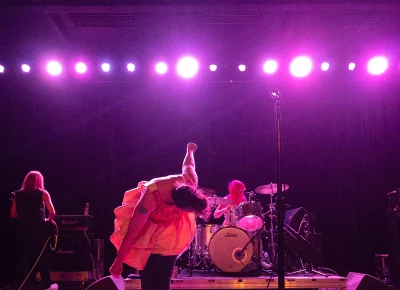Kathleen Hanna not only wails her heart out, she dances it out too.