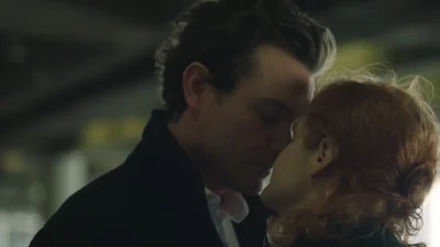 Sara and Joseph kiss.