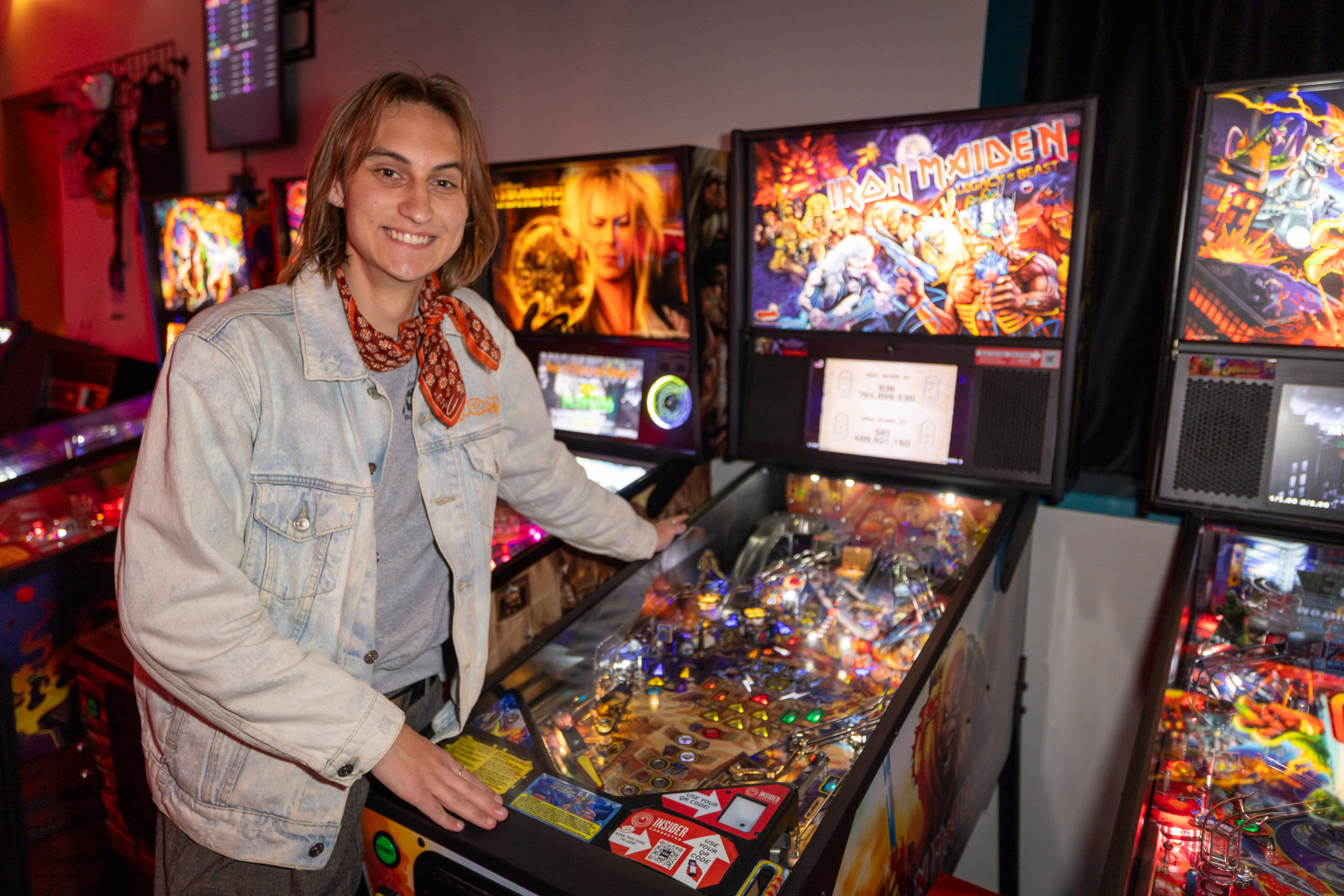 Tyler Van standing in front of a game console.