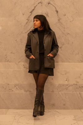 Aura Martinez Sandoval poses in an all-black outfit with a leather blazer.