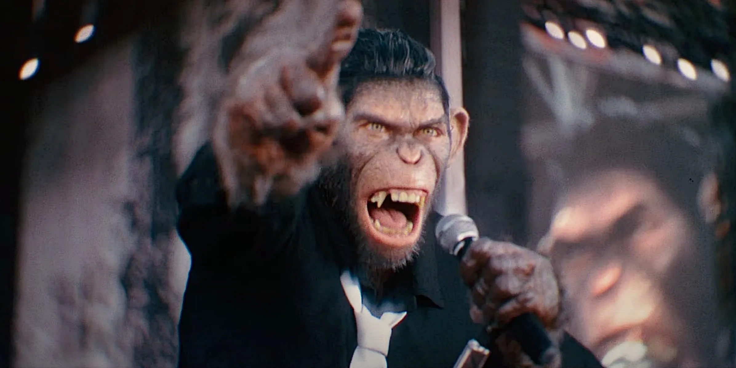 A monkey yells and points at the camera in Better Man.
