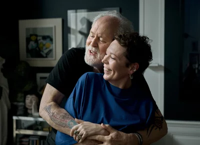 Jimpa (John Lithgow) and Hannah (Olivia Colman) holding each other.