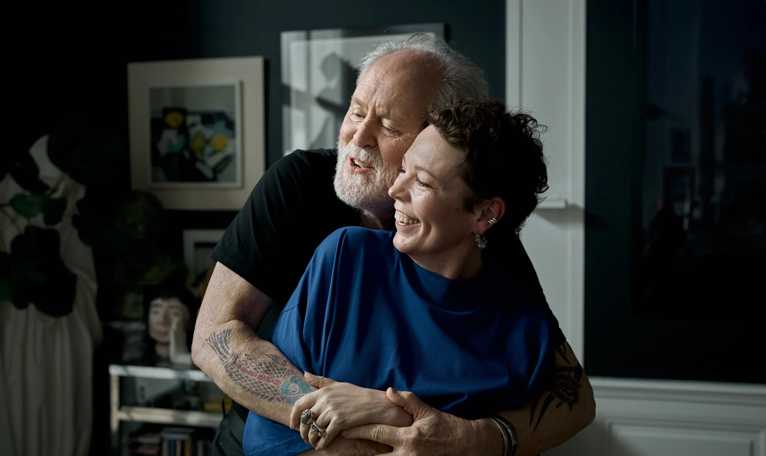 Jimpa (John Lithgow) and Hannah (Olivia Colman) holding each other.