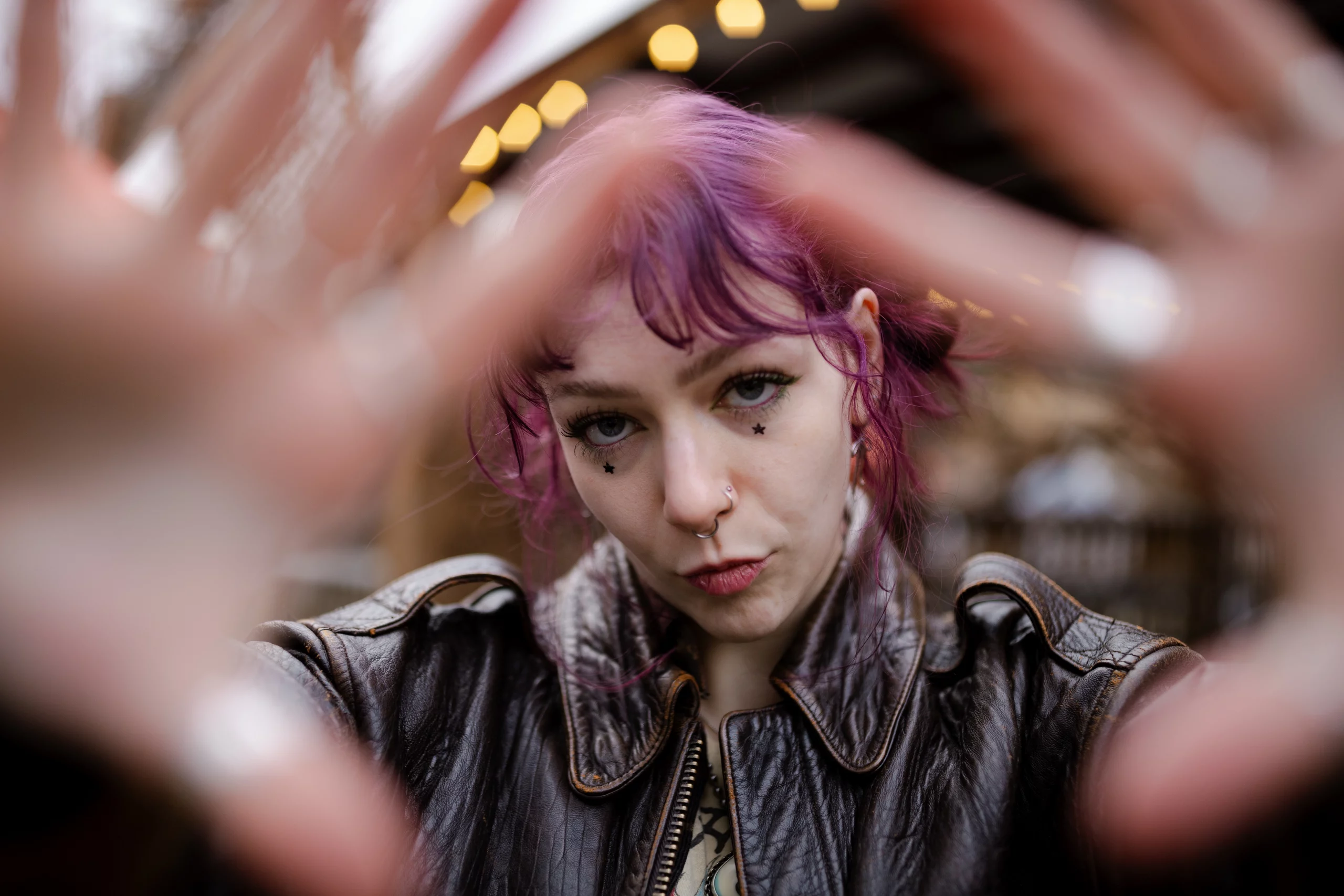 Croft holds her hands up to the camera.