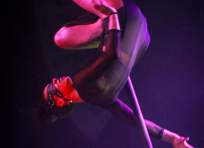 Blindfolded, Sierra wows the crowd with a suspended pole routine.