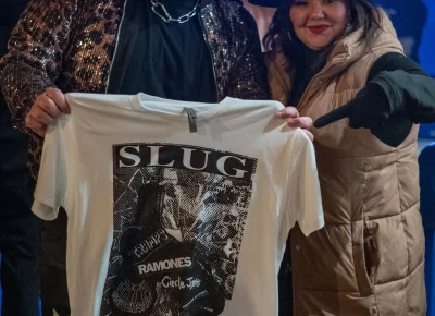 Partygoers pose with their custom SLUG shirt.