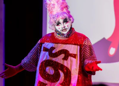 TomBoy the drag queen (Kyle Letender) speaks to the audience. Photo: Derek Brad