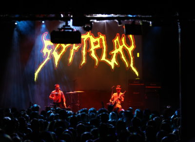 SOFT PLAY playing on stage with the audience shoulder to shoulder just below. Photo: Logan Sorenson.