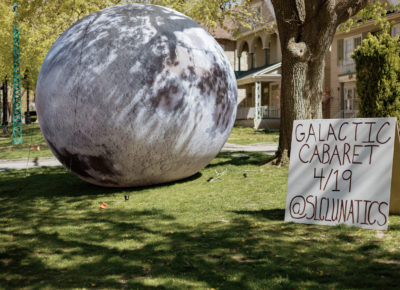 A sign and giant moon welcome guests to the cabaret location. Photo: Emily Sorensen.