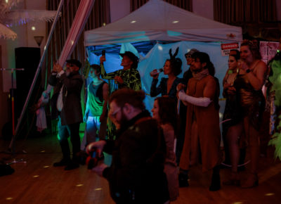 Onlookers laugh and cheer as the dancers perform. Photo: Emily Sorensen.