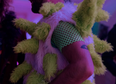 A cabaret attendee chats with friends in his fun galactic outfit. Photo: Emily Sorensen.