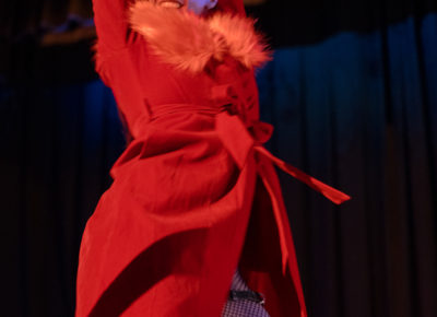 Sybley Wozmak re-energizes the room with an upbeat dance dressed in all red. Photo: Emily Sorensen.
