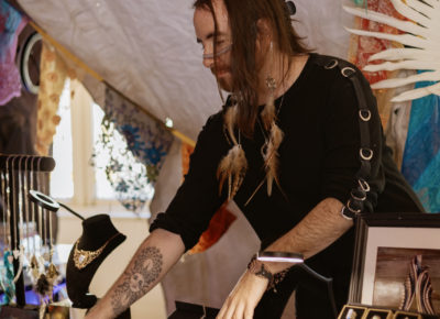 Juli Cardozo organizes jewelry during the craft market. Photo: Emily Sorensen.
