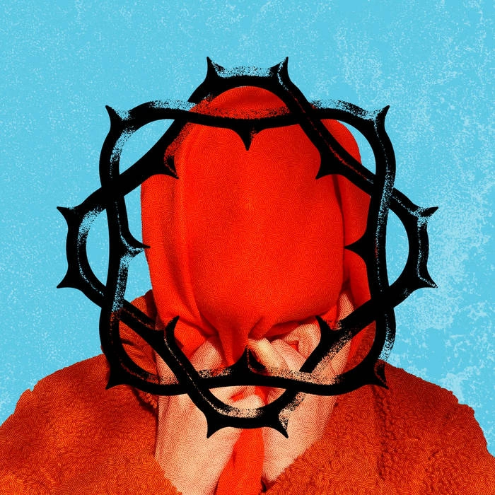 A man pulls a red hoodie down over his face, framed by a black, printed crown of thorns.