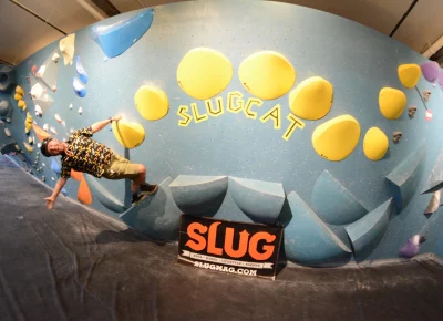 A man on a climbing wall.