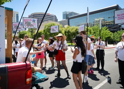 Angela H. Brown gets the team ready for a celebration. Photo: TaCara DeTevis.