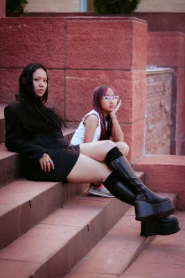 Cyndi and Celeste sitting on steps.