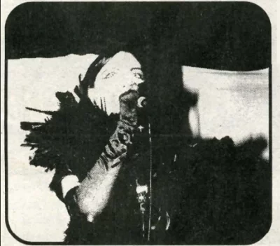 A woman sings into a microphone