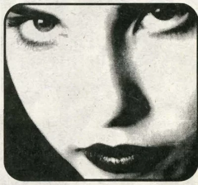 A closeup of a woman looking at the camera.